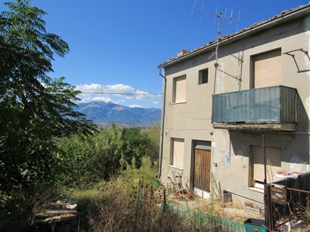 2 bed, 5000sqm of land, 200 meters to lively town and fabulous mountain views 